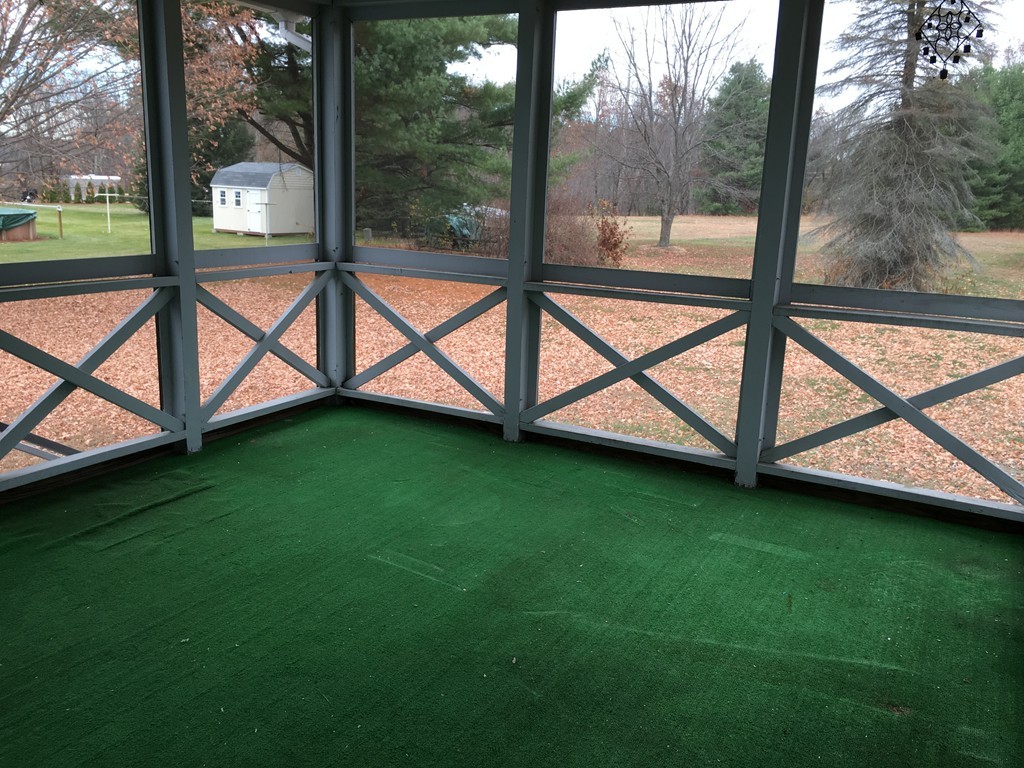 12 Mill Road Chelmsford, MA 01824 - Photo 3 of 11 a view of a backyard with a garden and deck