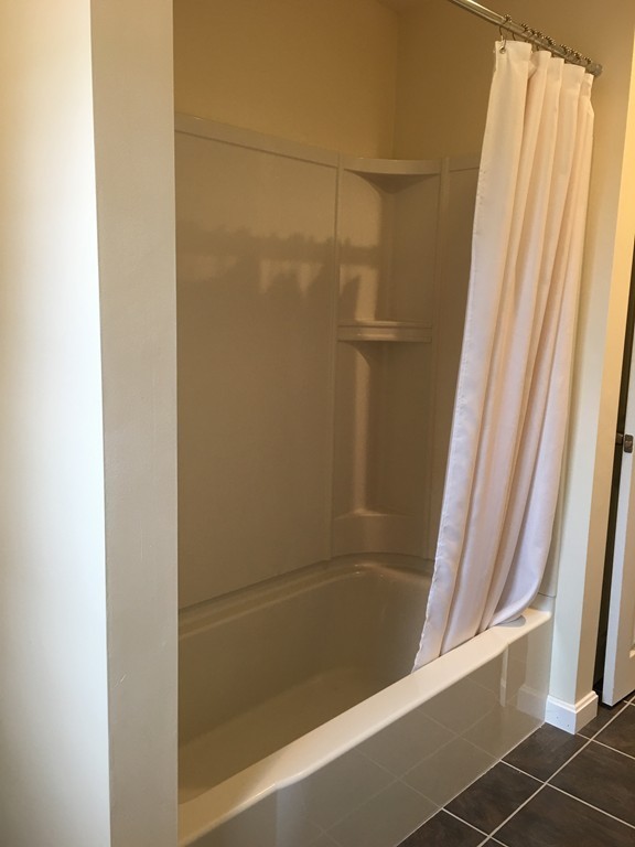12 Mill Road Chelmsford, MA 01824 - Photo 7 of 11 a bathroom with a bath tub