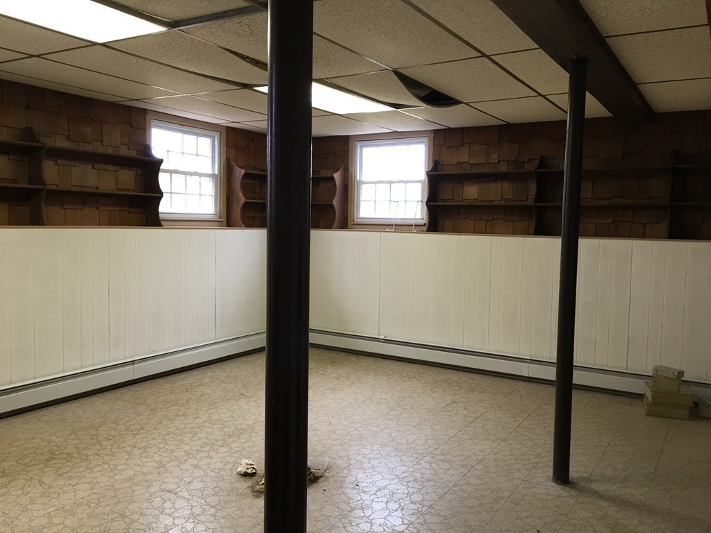 12 Mill Road Chelmsford, MA 01824 - Photo 8 of 11 a view of a room with rack on the wall