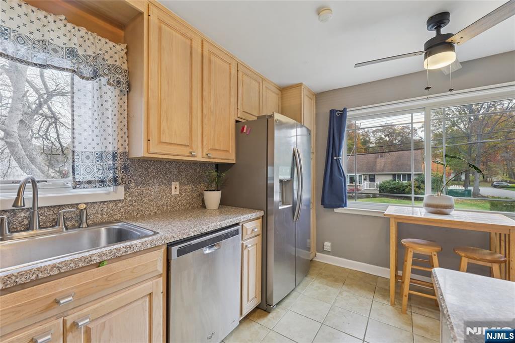 407 Semino Road Northvale, NJ 07647 - Photo 12 of 23 a kitchen with stainless steel appliances granite countertop a refrigerator and a sink