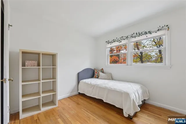 a bathroom with a sink mirror and toilet