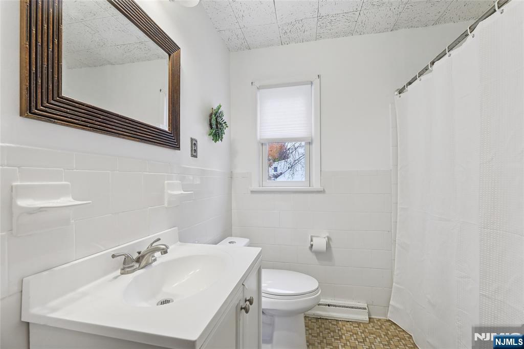 407 Semino Road Northvale, NJ 07647 - Photo 16 of 23 a bathroom with a sink mirror and toilet