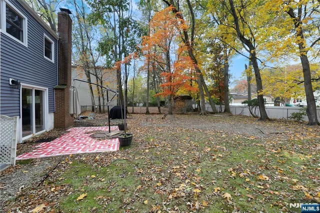a view of bathroom with a wooden floor and a window