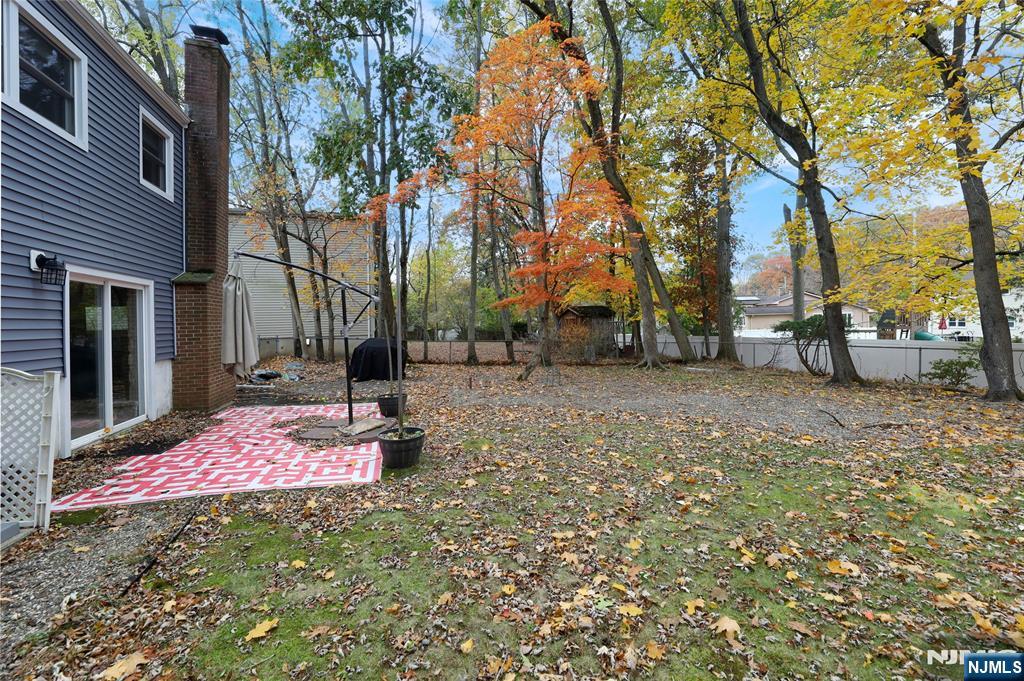 407 Semino Road Northvale, NJ 07647 - Photo 19 of 23 a backyard of a house with table and chairs