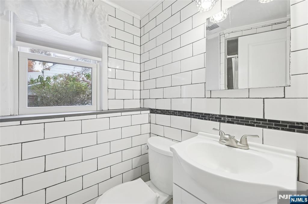 407 Semino Road Northvale, NJ 07647 - Photo 21 of 23 a bathroom with a sink a toilet and shower