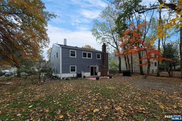 a view of a livingroom with furniture wooden floor and chandelier