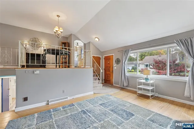 a kitchen with a refrigerator a stove a sink and a counter top space