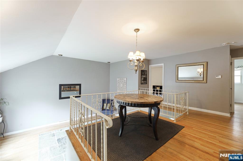 407 Semino Road Northvale, NJ 07647 - Photo 7 of 23 a view of a livingroom with furniture wooden floor and chandelier