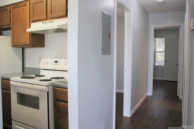 a kitchen with a stove and a microwave