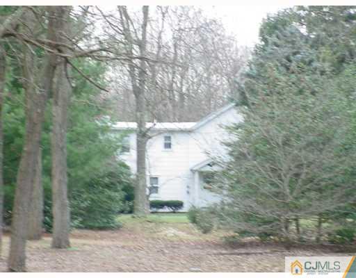 235 Cottrell Road Old Bridge, NJ 08857 - Photo 1 of 1 a view of a pathway of a forest