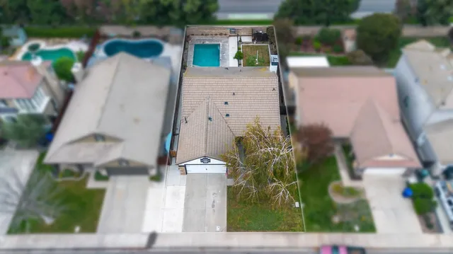 an aerial view of houses with yard