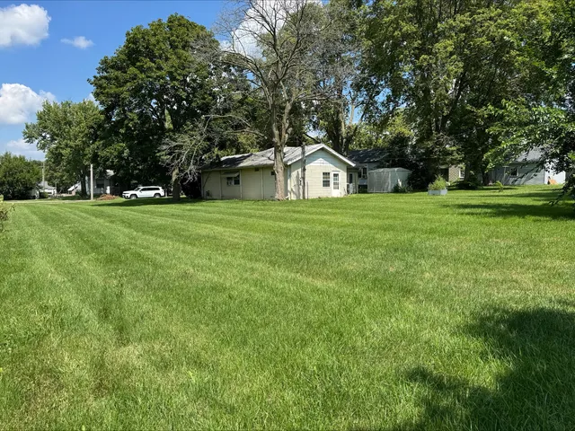 a view of a trees in a big yard with large trees