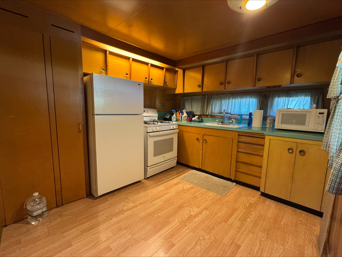 201 East Elm Street Chatsworth, IL 60921 - Photo 3 of 14 a kitchen with stainless steel appliances granite countertop a refrigerator a sink dishwasher a s stove top oven a dining table and chairs with wooden floor