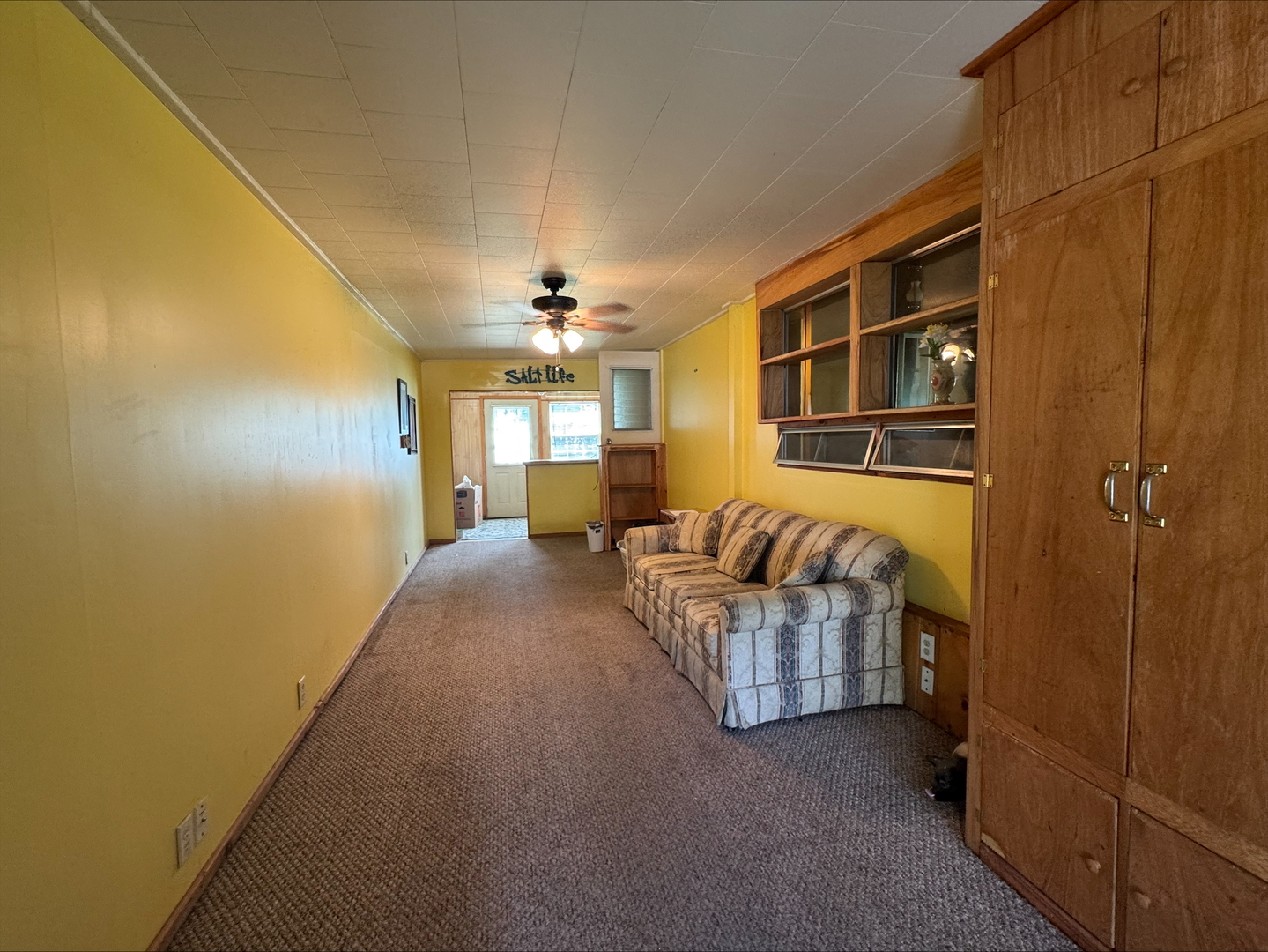 201 East Elm Street Chatsworth, IL 60921 - Photo 8 of 14 a living room with furniture and a chandelier