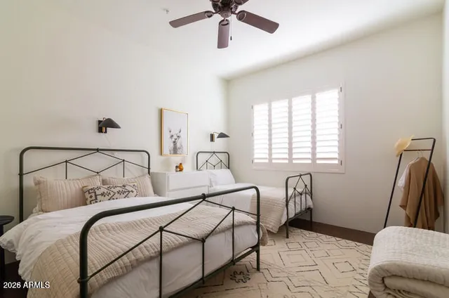 a bedroom with bed and window