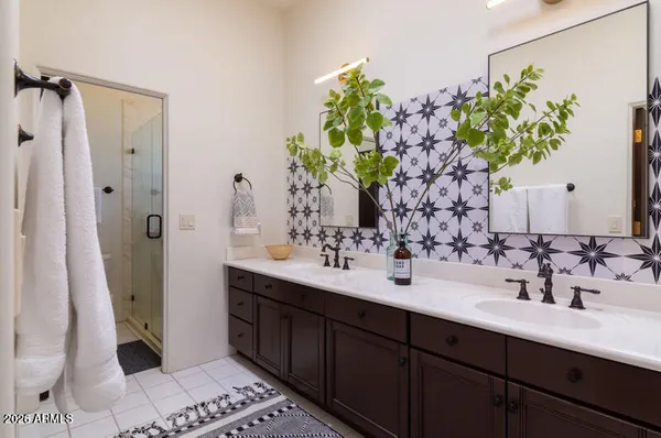 a bathroom with a sink a vanity and a mirror