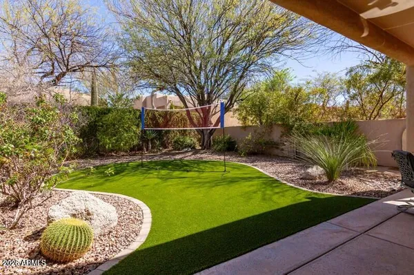 a view of a backyard with swimming pool
