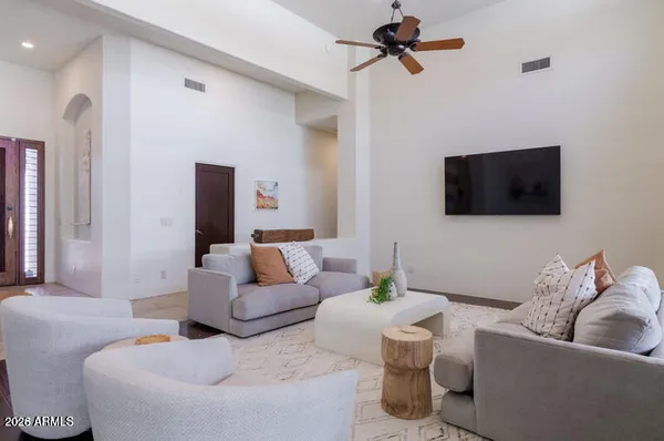 a living room with furniture and a flat screen tv