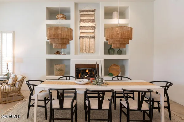 a dining room with furniture and window