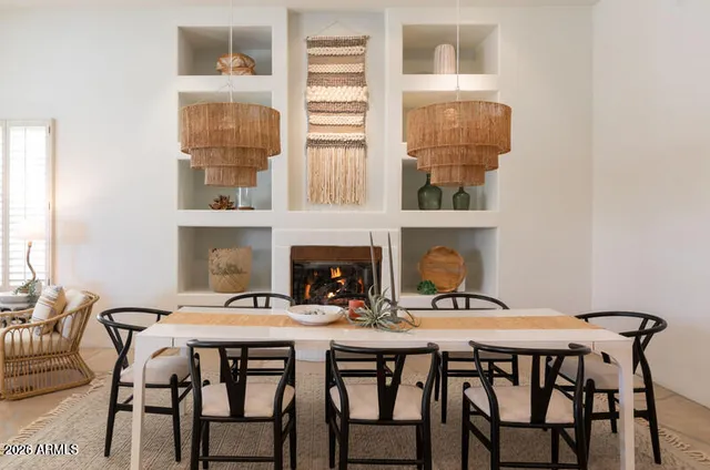 a dining room with furniture and window