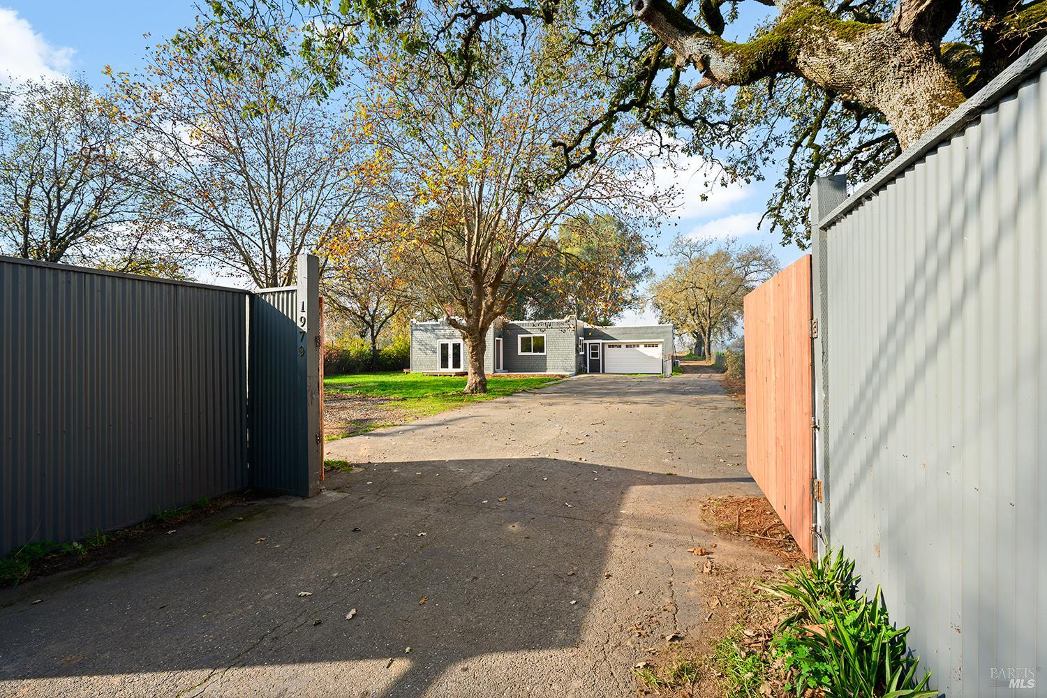 1979 Ludwig Avenue Santa Rosa, CA 95407 - Photo 1 of 52 a front view of a house with a yard and garage