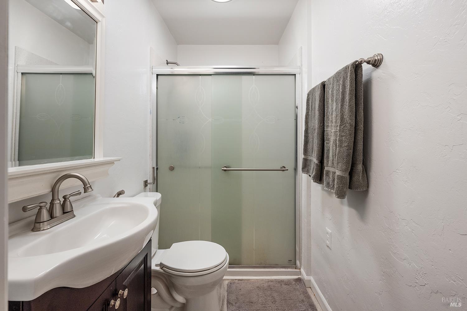 1979 Ludwig Avenue Santa Rosa, CA 95407 - Photo 26 of 52 a bathroom with a sink toilet and shower