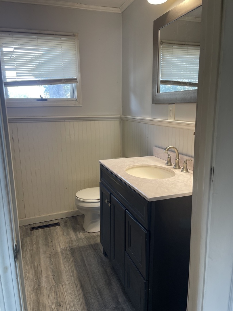 1824 16th Avenue Sterling, IL 61081 - Photo 13 of 26 a bathroom with a sink and a toilet