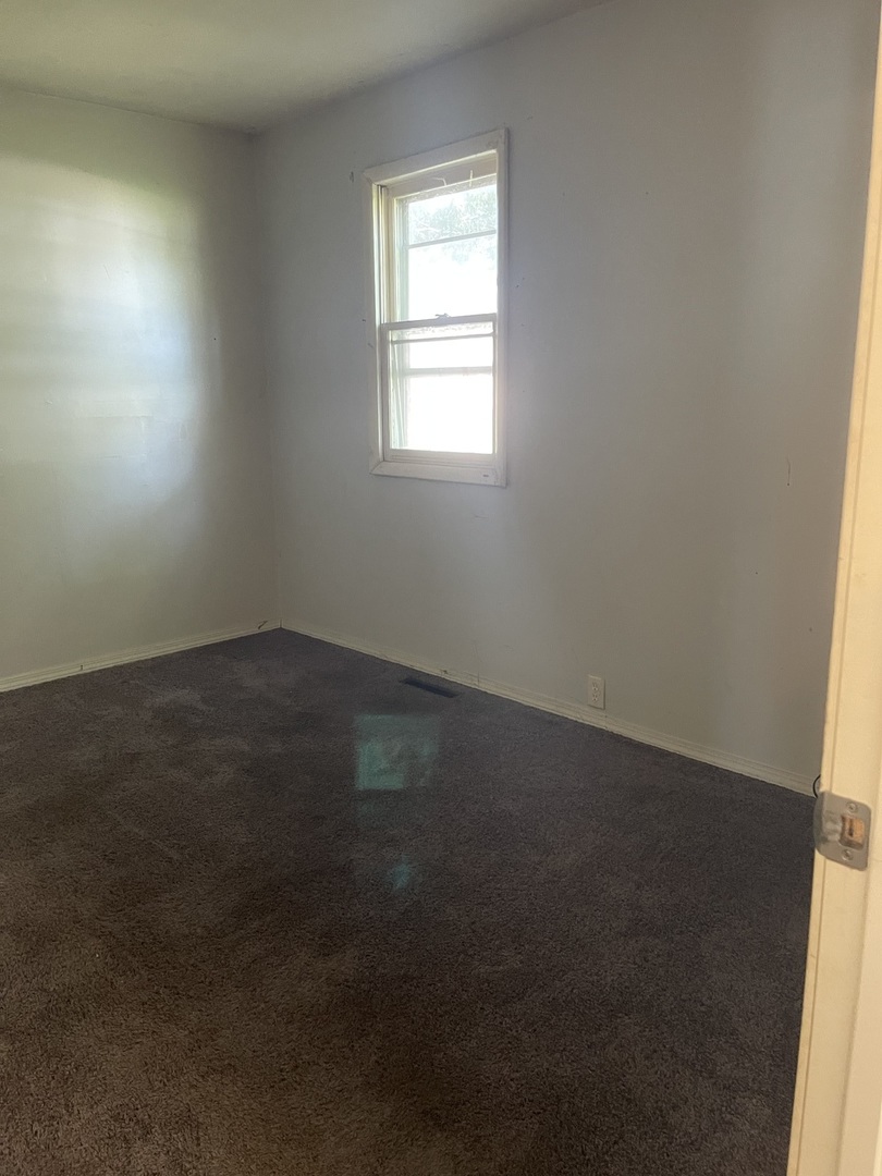 1824 16th Avenue Sterling, IL 61081 - Photo 20 of 26 an empty room with a window