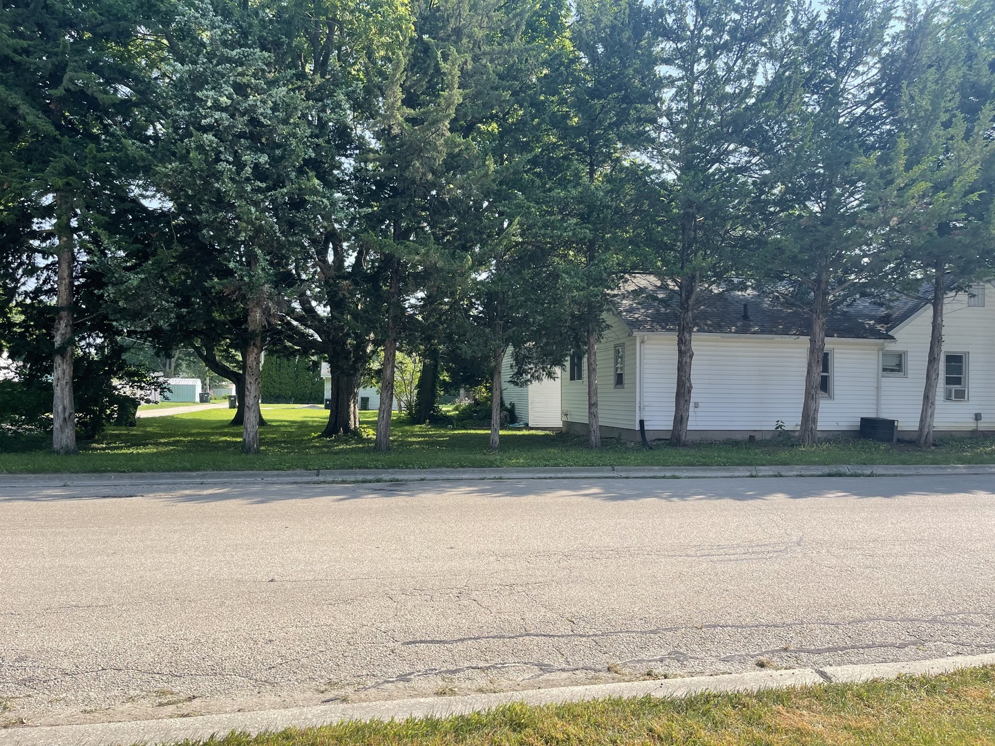 1824 16th Avenue Sterling, IL 61081 - Photo 23 of 26 a view of a yard with a house and large trees