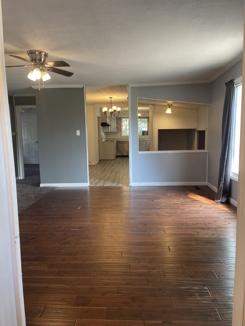 1824 16th Avenue Sterling, IL 61081 - Photo 6 of 26 a view of a livingroom with a kitchen