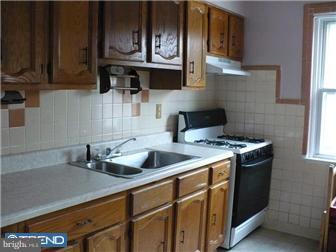 349 Avon Road Upper Darby, PA 19082 - Photo 7 of 10 a kitchen with stainless steel appliances granite countertop a sink a stove and cabinets