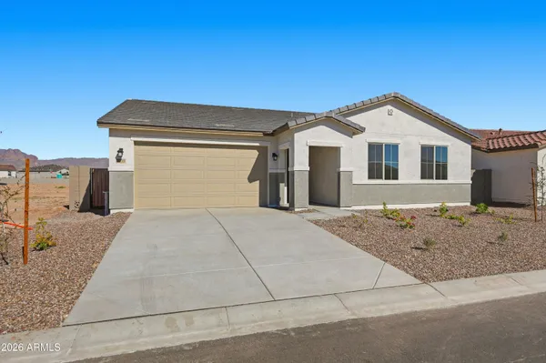 a front view of a house with garage