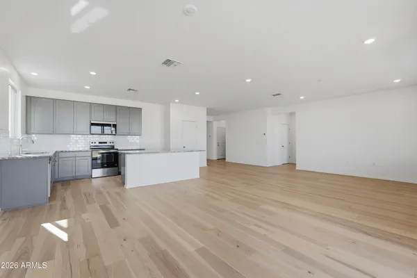 a view of kitchen with wooden floor