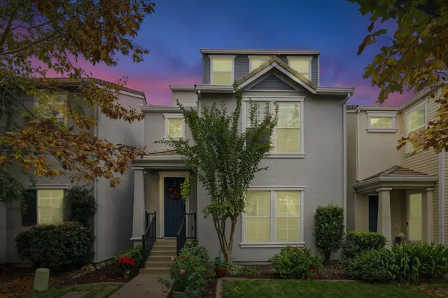 a front view of a house with garden