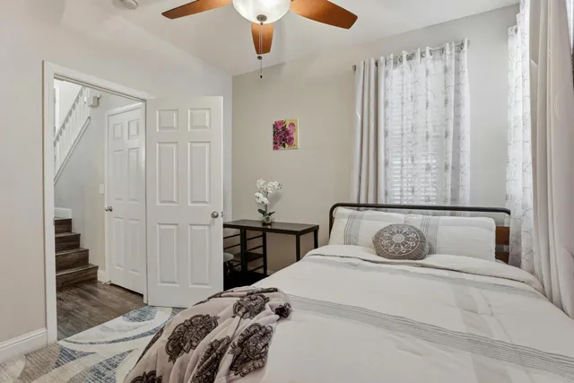 a bedroom with a bed and a window