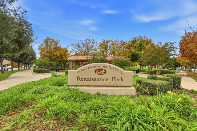 a view of a brick building next to a yard
