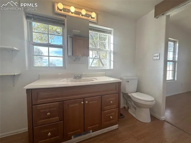 a kitchen with a sink and mirror