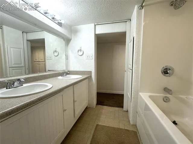 a view of a garage with parked cars