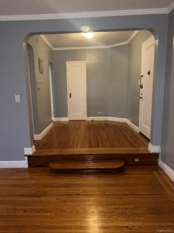 a bedroom with a bed and a mirror