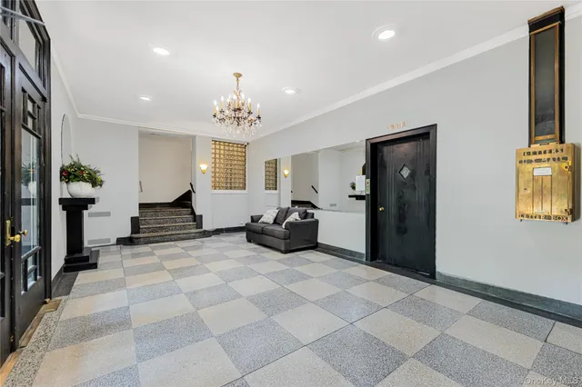 a view of a livingroom with a dinning area hardwood floor and a ceiling fan