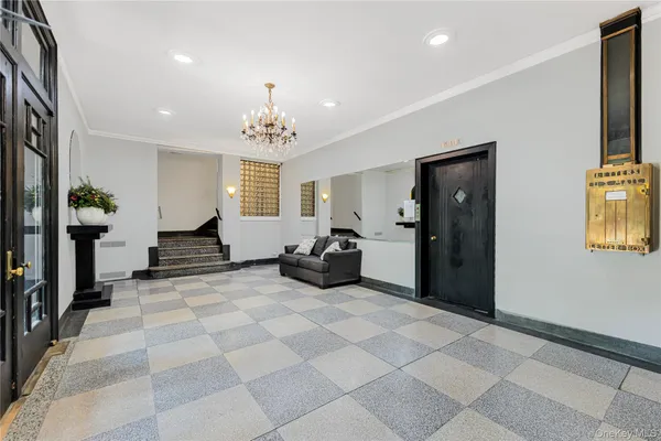 a view of a livingroom with a dinning area hardwood floor and a ceiling fan
