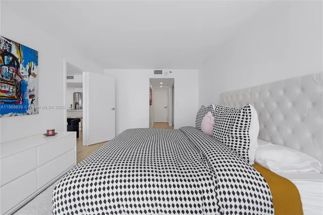 a bedroom with a bed and a walk in closet