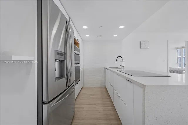 a view of a hallway with a sink
