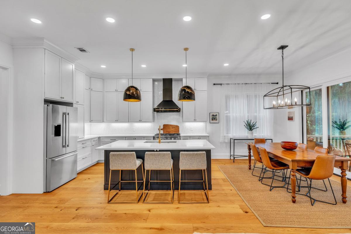 822 Dancy Avenue Savannah, GA 31419 - Photo 16 of 73 a living room with stainless steel appliances kitchen island granite countertop furniture wooden floor and a kitchen view