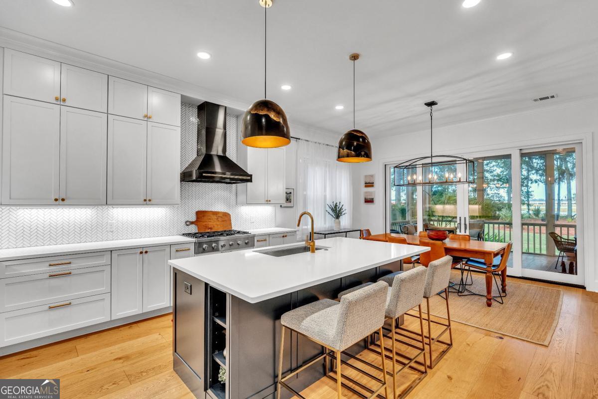 822 Dancy Avenue Savannah, GA 31419 - Photo 17 of 73 a kitchen with a sink a counter space appliances and cabinets