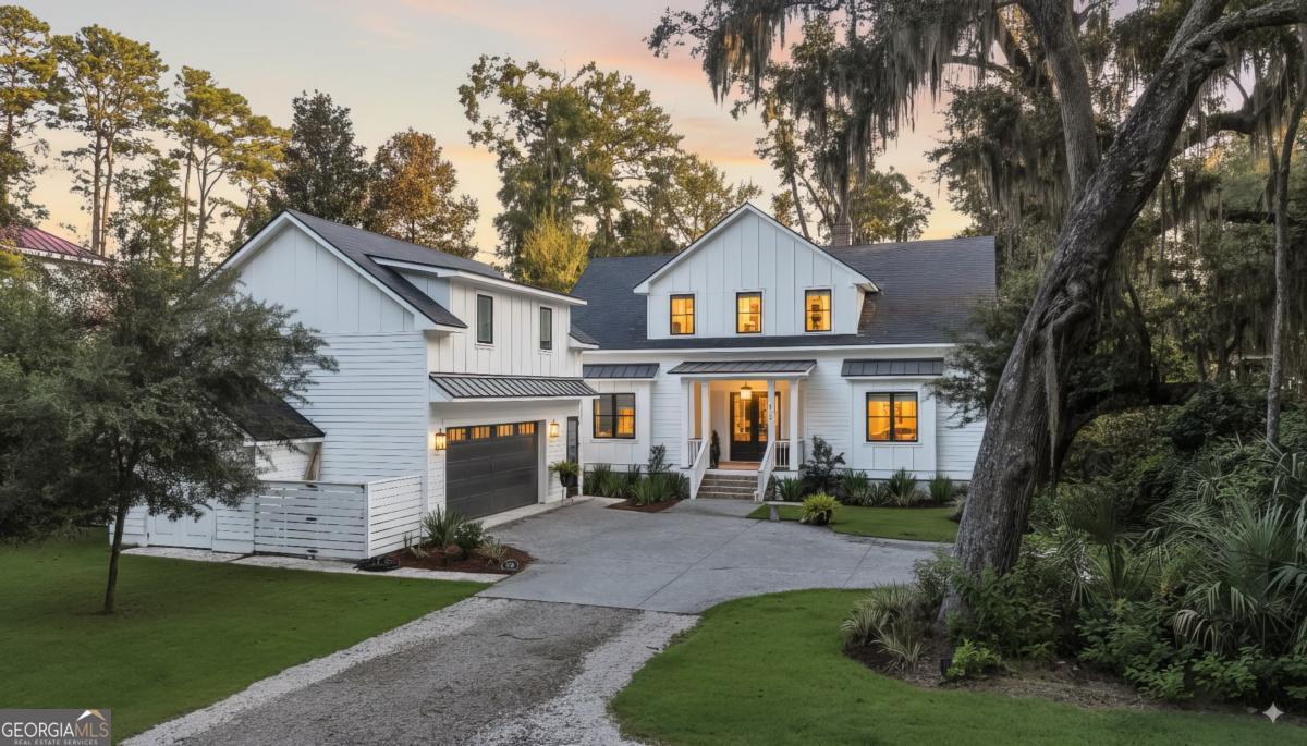 822 Dancy Avenue Savannah, GA 31419 - Photo 2 of 73 a front view of a house with a garden and trees
