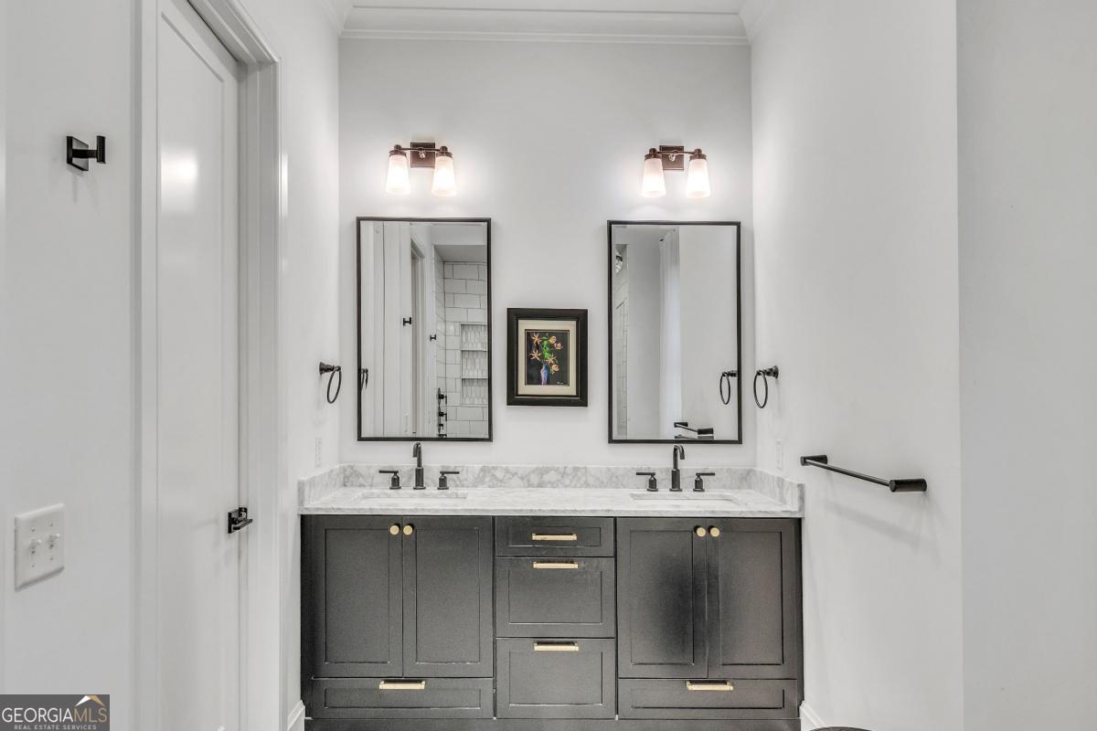 822 Dancy Avenue Savannah, GA 31419 - Photo 30 of 73 a bathroom with double vanity and a mirror