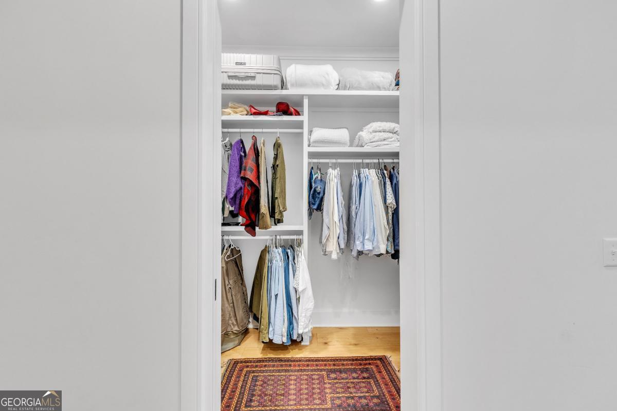 822 Dancy Avenue Savannah, GA 31419 - Photo 32 of 73 a view of walk in closet with clothes and shoes