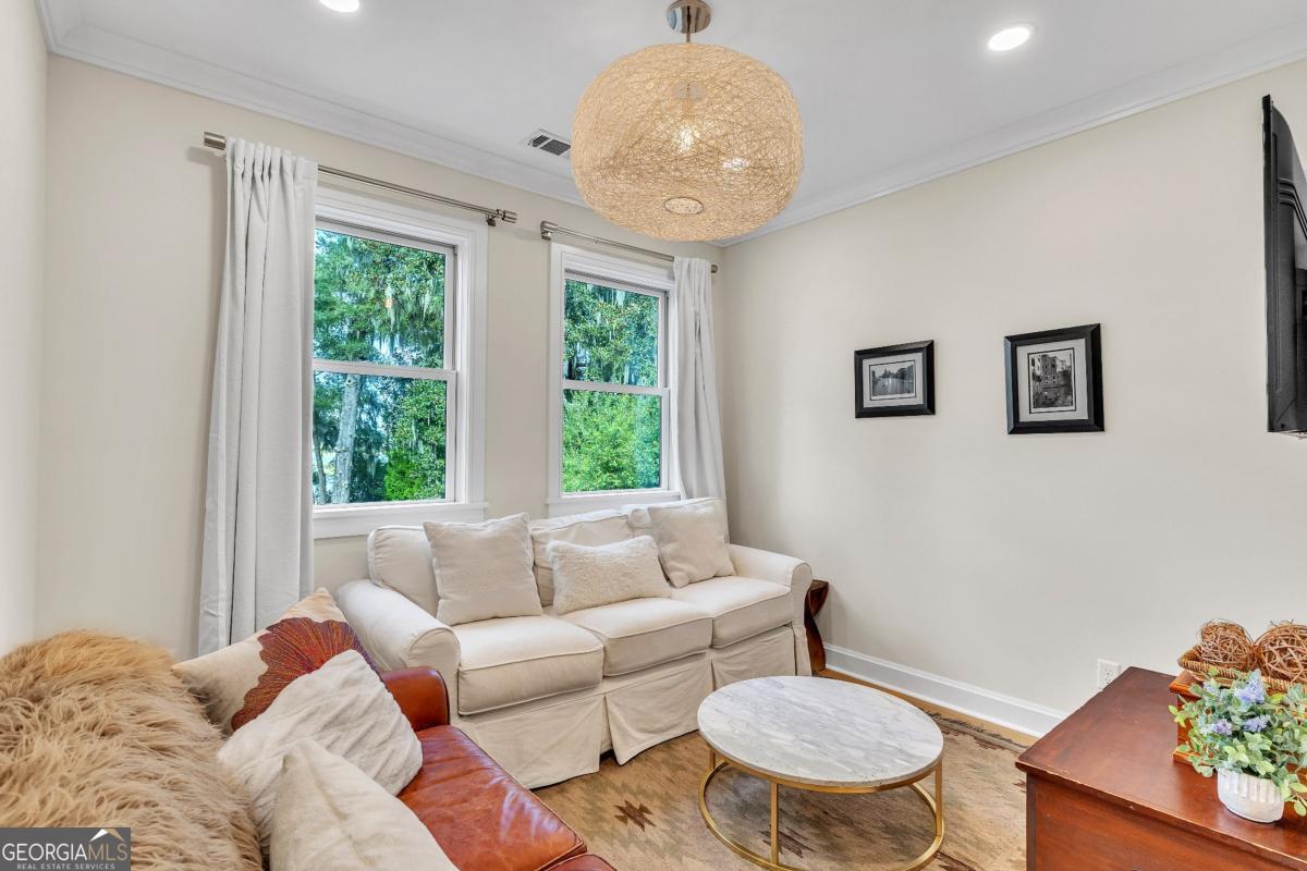 822 Dancy Avenue Savannah, GA 31419 - Photo 43 of 73 a living room with furniture and a large window