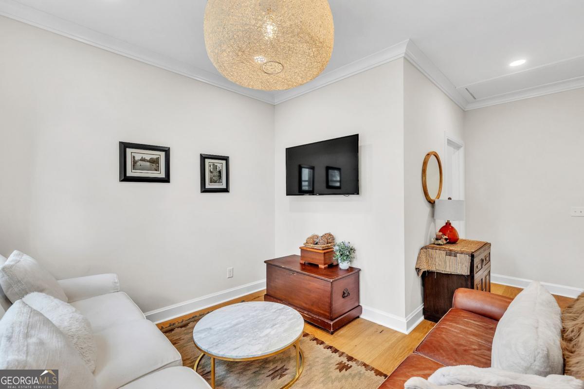822 Dancy Avenue Savannah, GA 31419 - Photo 44 of 73 a living room with furniture a rug and a mirror